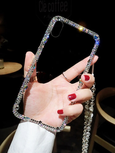 Funda transparente diamantes imitación iPhone con colgante.