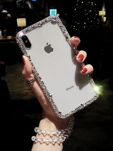 Funda transparente diamantes imitación iPhone con colgante.