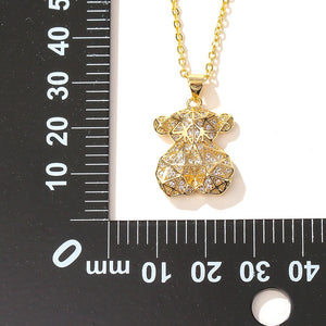 Hollow Jewelry: Collares y colgante oso cobre chapada oro.